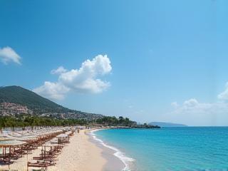 Beach in Antalya with mountains in the background